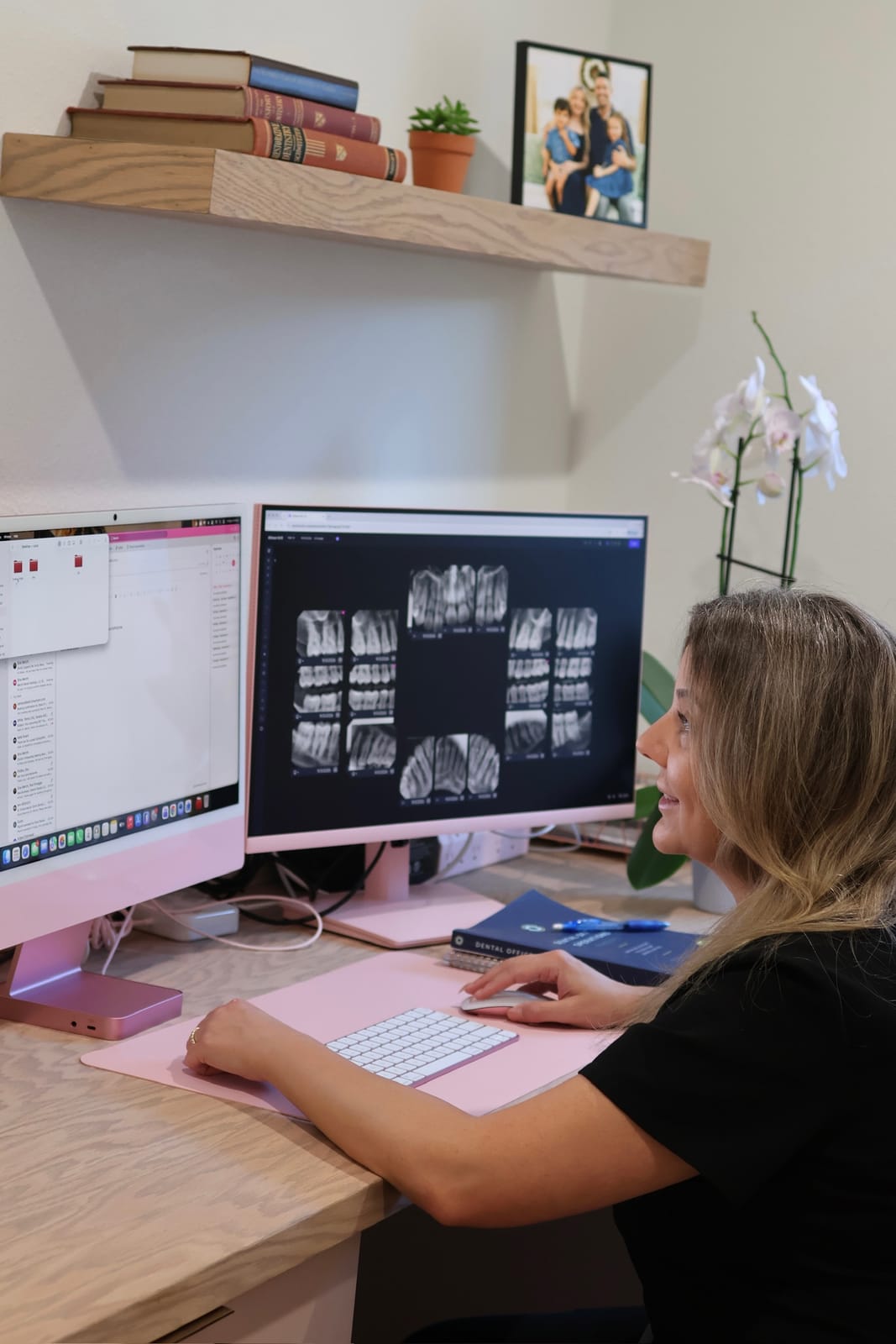 Dr. Merchi reviewing digital X-rays on screen at her desk in the Riverview office